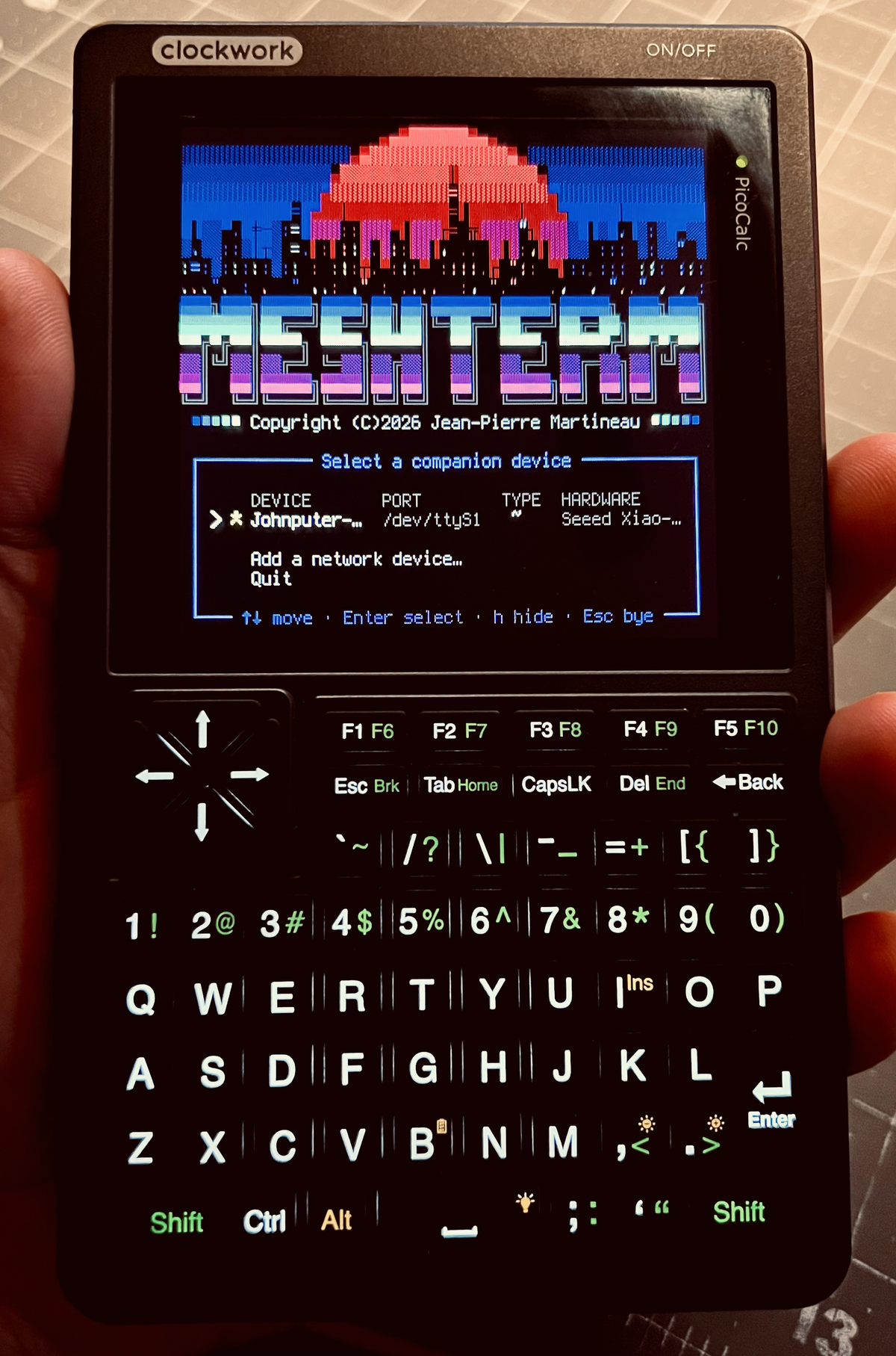 MeshTerm on the PicoCalc, a 53-column console with a radio wired inside